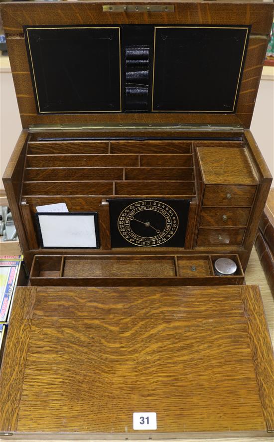 An oak writing cabinet